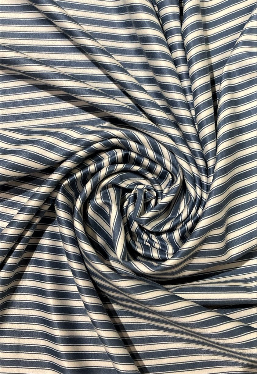 Striped fabric with blue and white horizontal stripes.