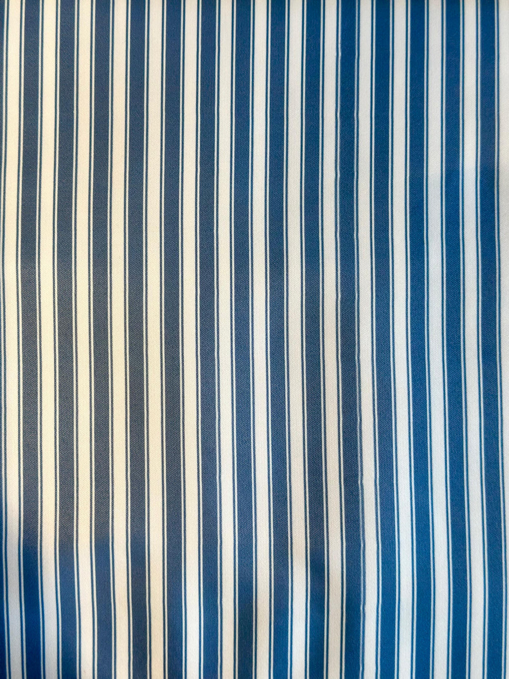 Striped fabric with blue and white vertical stripes